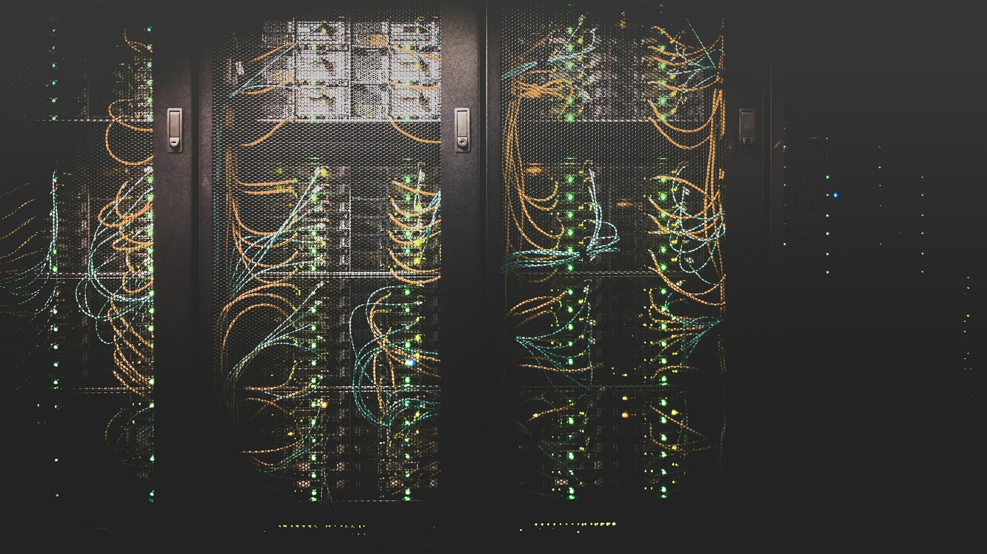Enterprise data center cabinet with active fiber patch cabling, representative of the managed infrastructure environments IT KORR operates